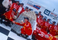 Jimmy Vasser counts his money after winning the 1996 US 500