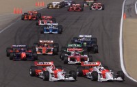 Gil de Ferran takes the lead in front of teammate Helio Castroneves at Laguna Seca in 2001